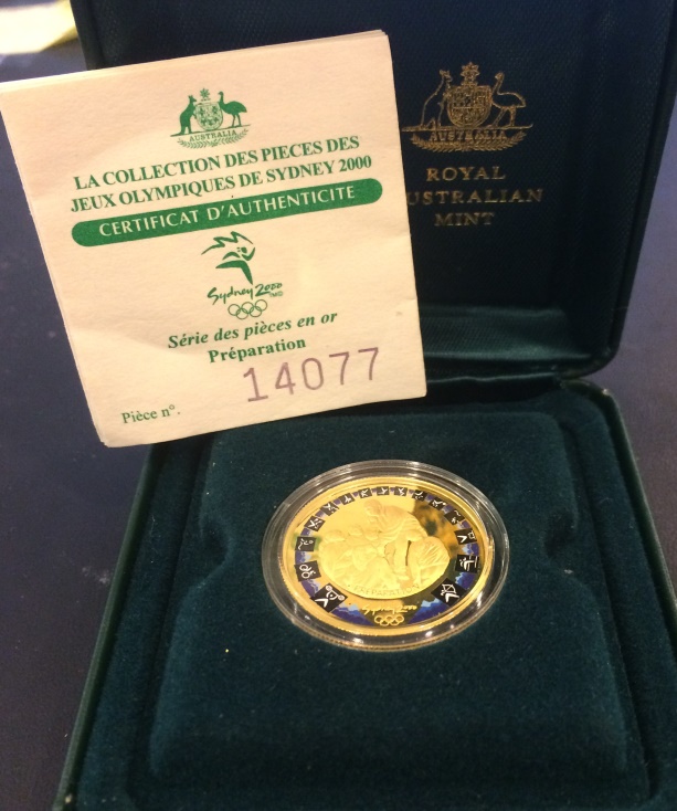 Olimpiadi di Sidney - 100 dollari gr. 10,02 in oro 999/000 in conf. originale
